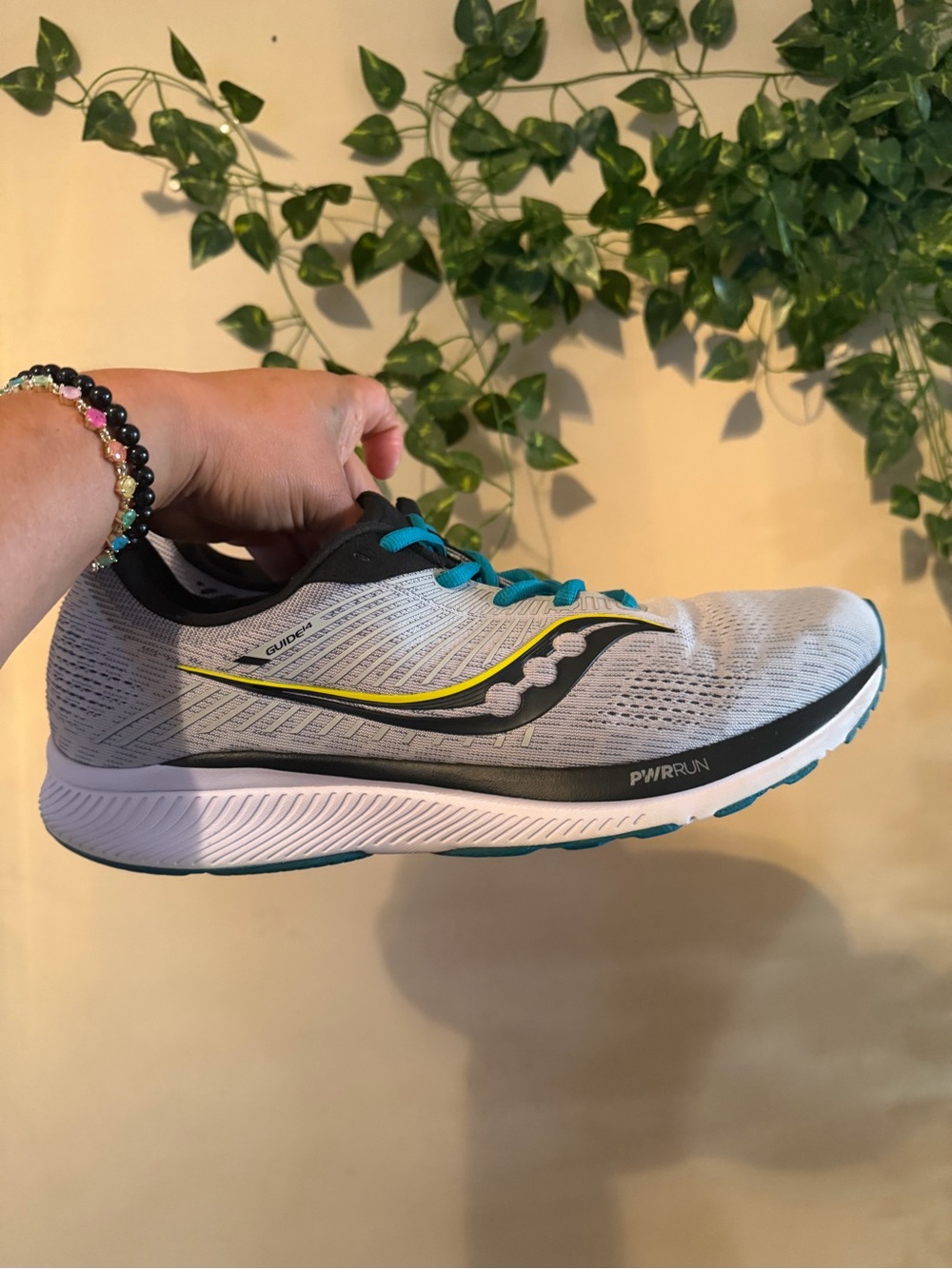 Saucony Neutral Run Shoe in Light Gray with Teal and Yellow Accents